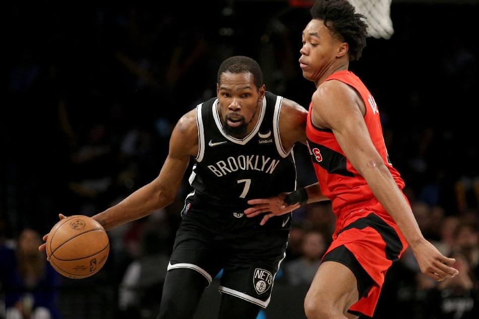 Brooklyn Nets forward Kevin Durant (7) controls the ball against Toronto Raptors forward Scottie Barnes (4) during the fourth quarter at Barclays Center. Brad Penner, USA TODAY Sports/Reuters