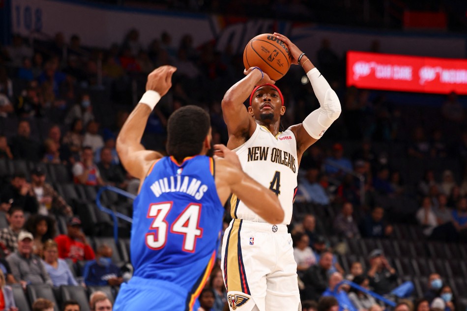 Devonte' Graham #4 of the New Orleans Pelicans shoots the ball during the game against the Oklahoma City Thunder on December 15, 2021 at Paycom Arena in Oklahoma City, Oklahoma. Zach Beeker, NBAE via Getty Images/AFP