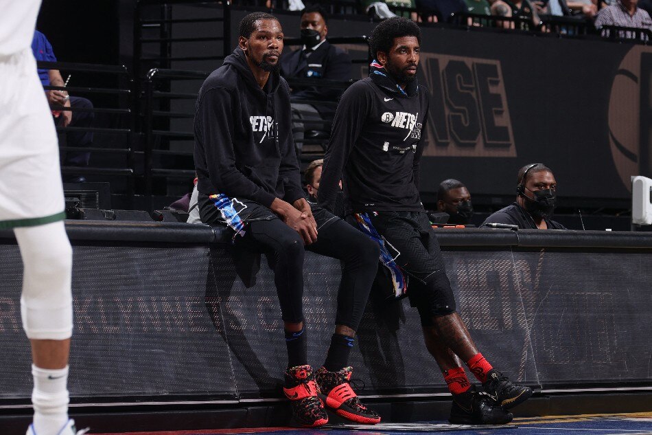 Kevin Durant #7 of the Brooklyn Nets and Kyrie Irving #11 of the Brooklyn Nets looks on during Round 2, Game 2 of the 2021 NBA Playoffs on June 7, 2021 at Barclays Center in Brooklyn, New York. File photo. Nathaniel S. Butler, NBAE via Getty Images/AFP.