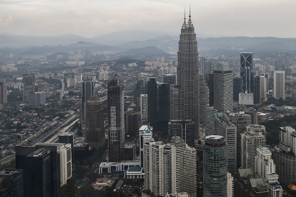 Malaysia's landmark Petronas Twin Towers and other commercial buildings are seen after a heavy downpour from the KL Tower observation deck in Kuala Lumpur on November 24, 2016. Photo by Mohd Rasfan, AFP