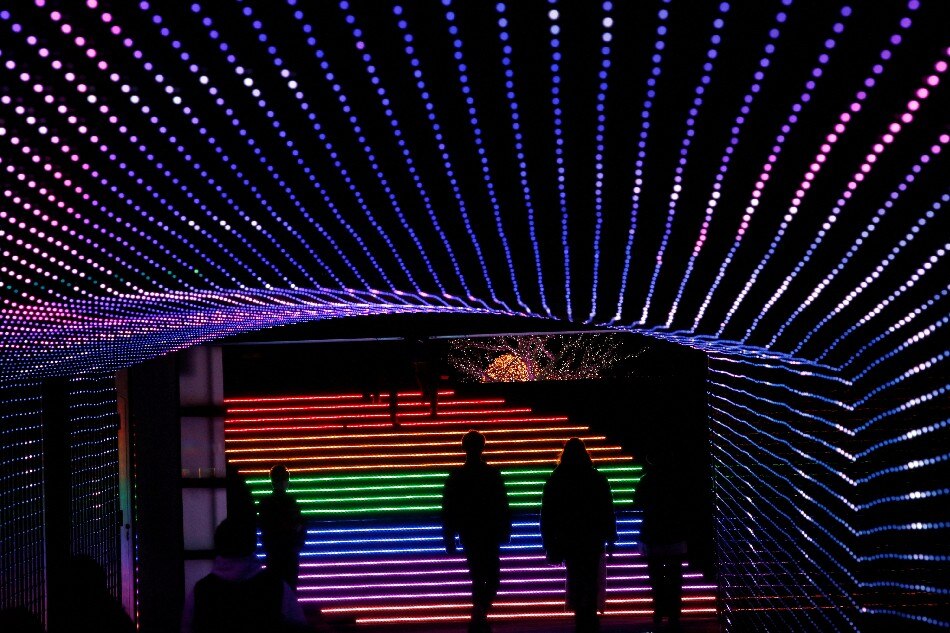 Visitors walk around the Tokyo Mega Illumination at the Tokyo City Keiba horse racing track in Tokyo, Japan, Dec. 23, 2021. Kim Kyung-Hoon, Reuters