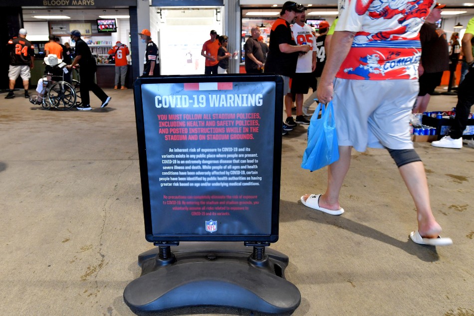  A detail of Covid-19 related signage prior to the game between the Houston Texans and the Cleveland Browns at FirstEnergy Stadium on September 19, 2021 in Cleveland, Ohio. Jason Miller, Getty Images/AFP