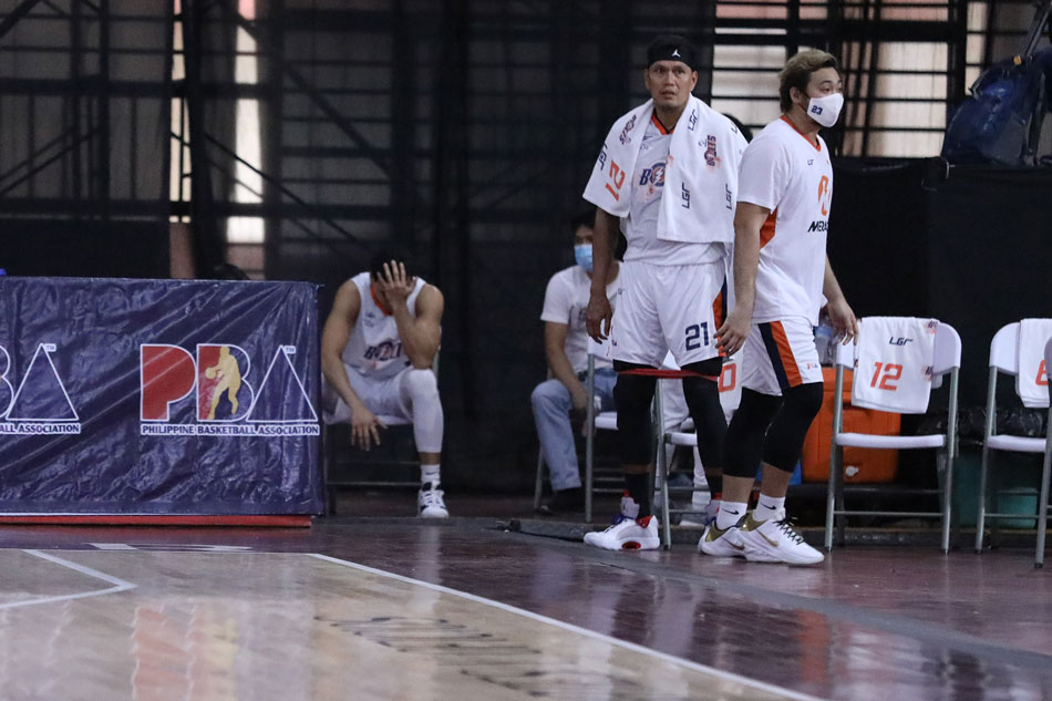 Aaron Black sits at the sidelines after injuring his right hand in the Meralco-TerraFirma game. PBA Media Bureau