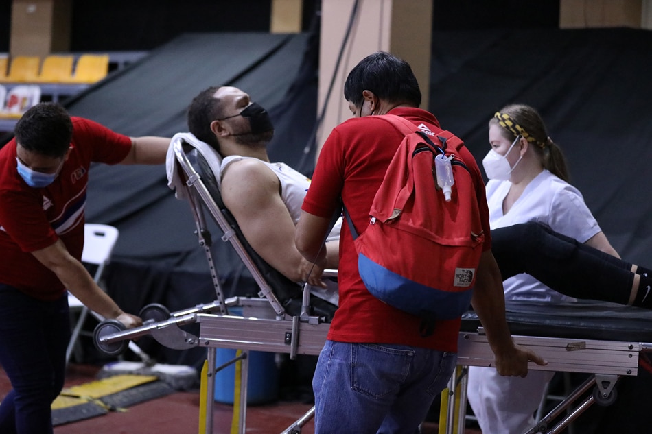 TNT center Kelly Williams is stretchered out of the Don Honorio Ventura State University Gym. PBA Media Bureau