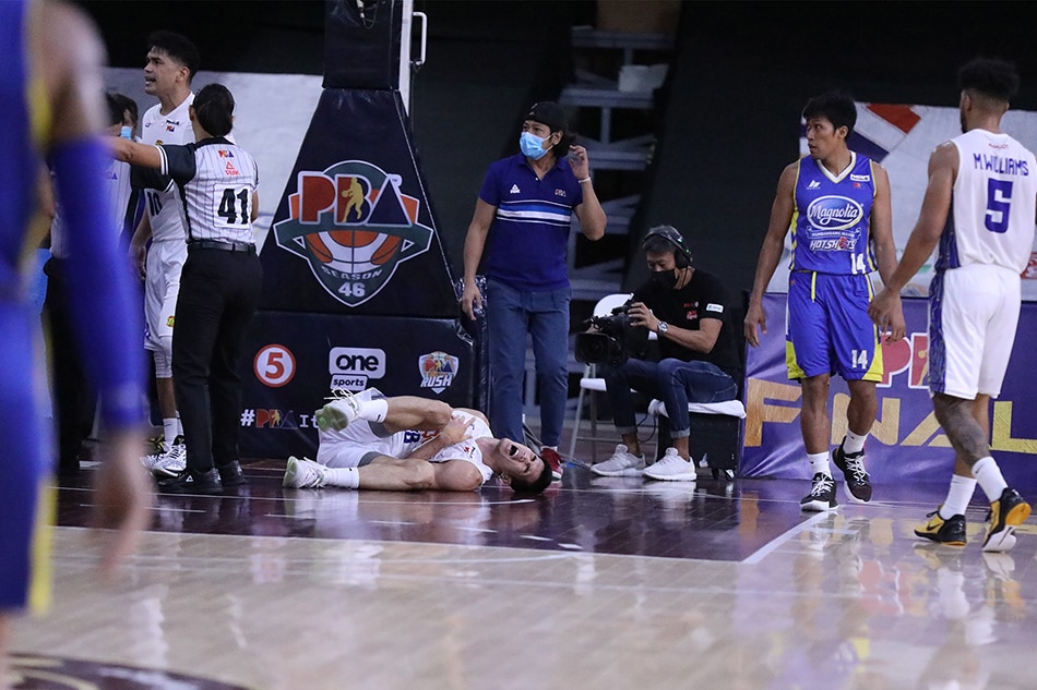 Troy Rosario had to be helped off the court after suffering an injury in Game 3. PBA Media Bureau