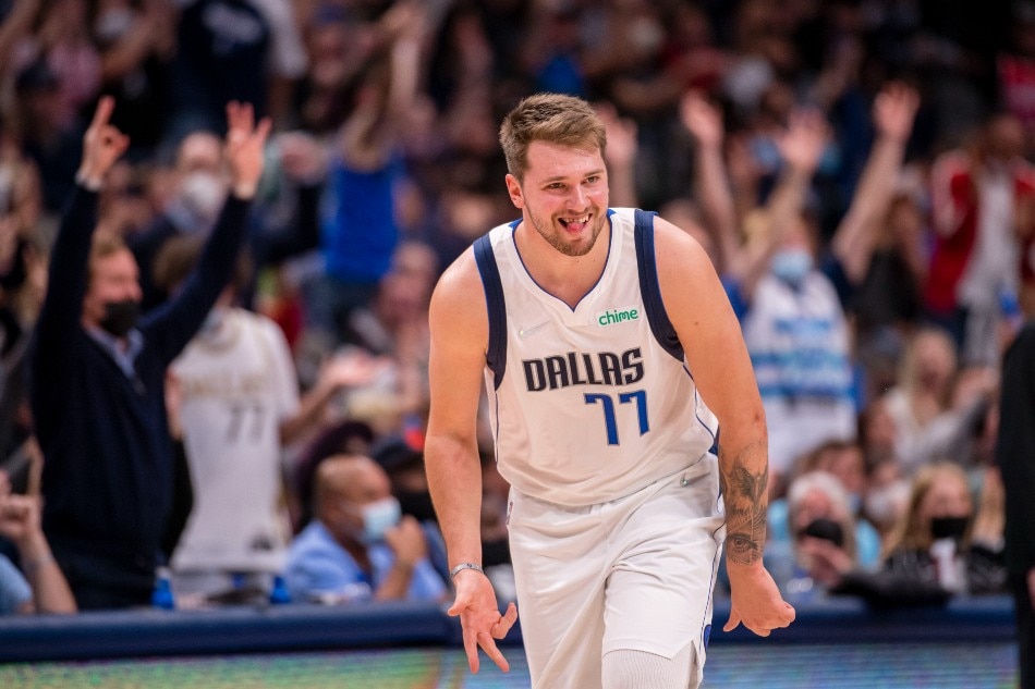 Dallas, Texas, USA; Dallas Mavericks guard Luka Doncic (77) celebrates making a three point shot against the San Antonio Spurs during the second half at the American Airlines Center. Jerome Miron-USA TODAY Sports