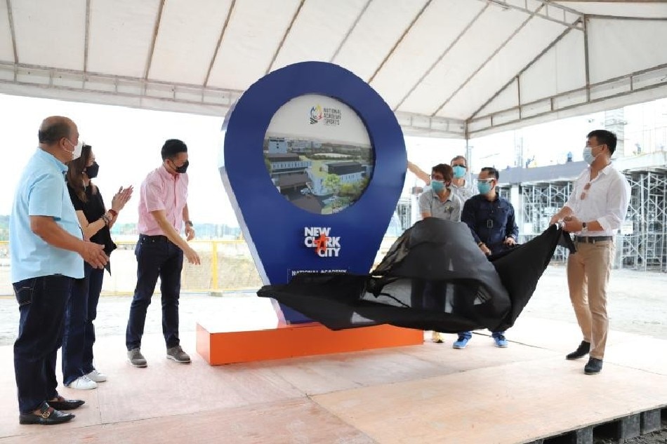 Officials unveil the ceremonial marker for the construction of facilities at the National Academy of Sports campus in New Clark City, Tarlac. Photo courtesy of the Department of Education