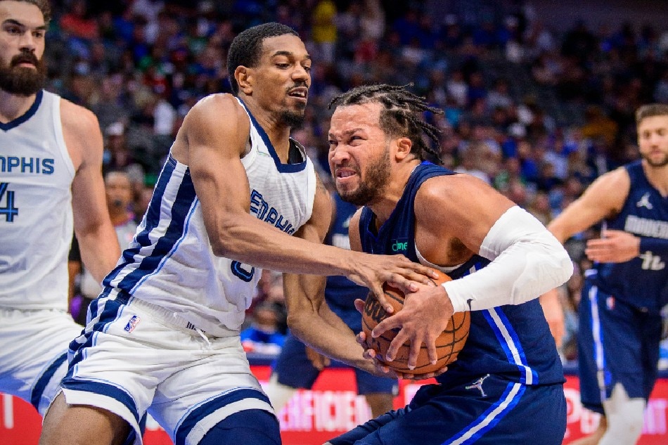 Memphis Grizzlies guard De'Anthony Melton (0) attempts to steal the ball from Dallas Mavericks guard Jalen Brunson (13) during the second half at the American Airlines Center. Jerome Miron, USA TODAY Sports/Reuters.