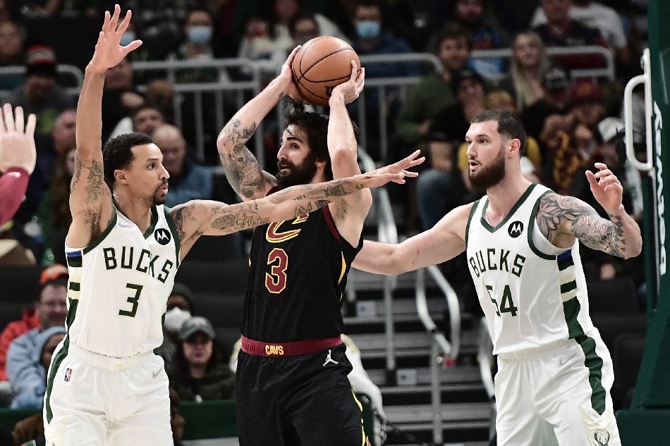 Milwaukee Bucks guard George Hill (3) and forward Sandro Mamukelashvili (54) defend against Cleveland Cavaliers guard Ricky Rubio (3) in the second quarter at Fiserv Forum. Benny Sieu, USA TODAY Sports/Reuters.