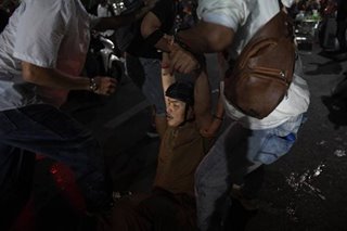 Thai police clash with protesters near king's palace