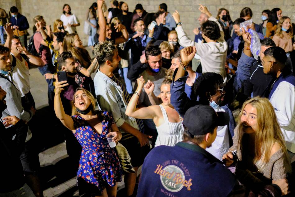 &#39;Freedom&#39; fiestas: Spaniards celebrate end of COVID curfew 1