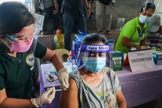 Agoncillo evacuees receive COVID-19 vaccine