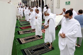 Masked haj pilgrims on Mount Arafat pray for COVID-free world