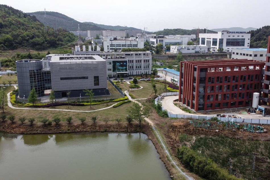 An aerial view shows the P4 laboratory (L) at the Wuhan Institute of Virology in Wuhan in China's central Hubei province on April 17, 2020. The P4 epidemiological laboratory was built in co-operation with French bio-industrial firm Institut Merieux and the Chinese Academy of Sciences. The facility is among a handful of labs around the world cleared to handle Class 4 pathogens (P4) - dangerous viruses that pose a high risk of person-to-person transmission