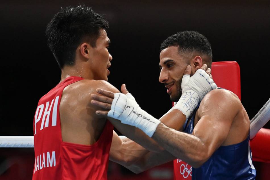 Carlo Paalam  of the Philippines congratulates Galal Yafai of Britain after their Men’s Flyweight boxing final at the Tokyo 2020 Olympics at the Kokugikan Arena in Tokyo, Japan on August 7, 2021. Ueslei Marcelino, Reuters