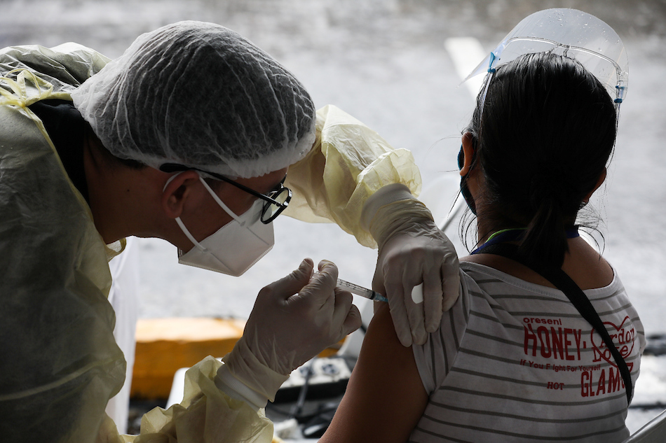 Public transportation drivers and delivery riders are vaccinated against COVID-19 at the Vaccine Express-Quezon City, a vaccination initiative under the Office of the Vice President, in a mall in Quezon City