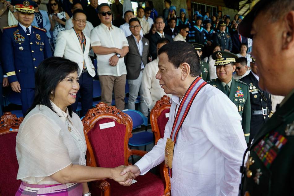 President Rodrigo Duterte greets Vice President Maria Leonor Robredo on the sidelines of the commencement exercises of the Philippine Military Academy in Baguio City on May 26, 2019. King Rodriguez, Presidential Photo/File