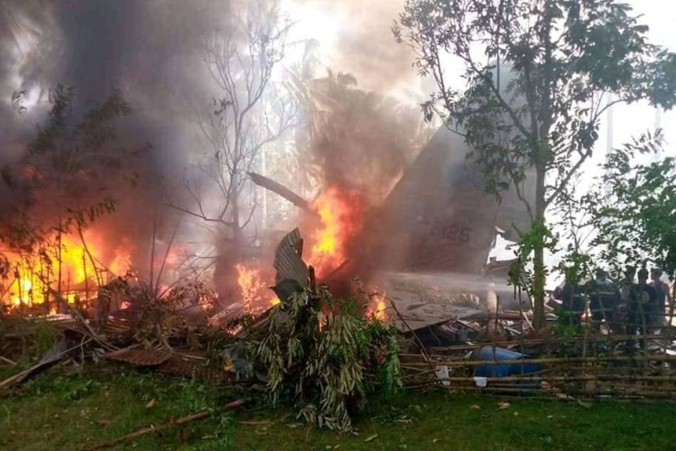 A C-130 aircraft of the Philippine Air Force with tail #5125 burns after it crashed in Barangay Bangkal, Patikul, Sulu on July 4, 2021. Photo courtesy of Pondohan TV