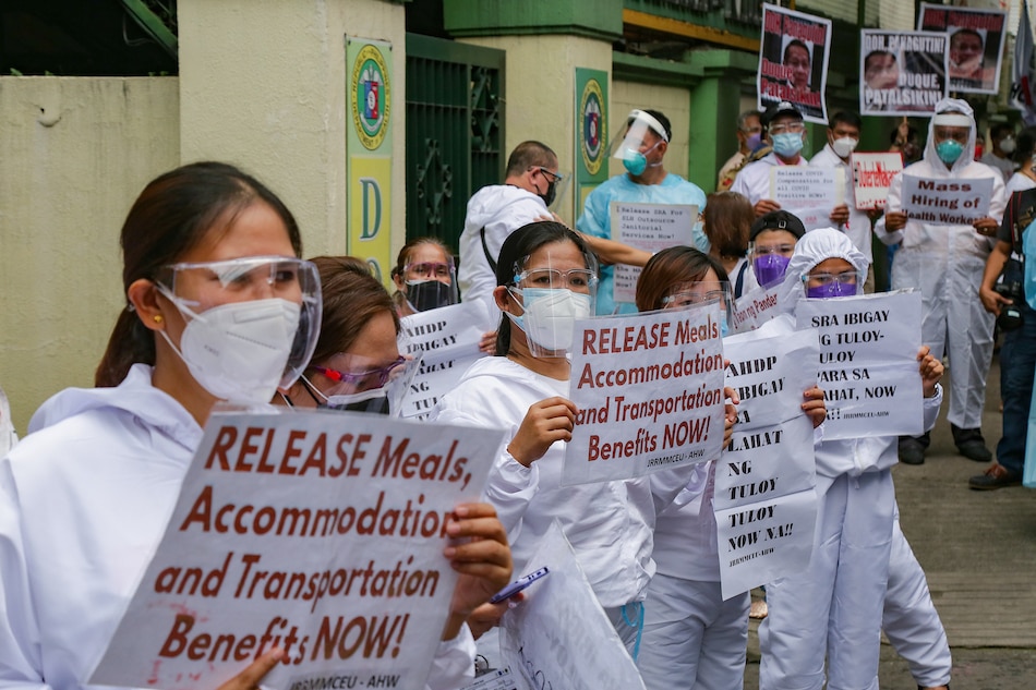  Health-care workers from different hospitals gather in front of the Department of Health headquarters in Sta. Cruz, Manila on Sept. 1, 2021. The group called for the resignation of Health Secretary Francisco Duque III and slammed the department’s alleged failure to release all the benefits for health-care workers both in public and private facilities. George Calvelo, ABS-CBN News/File