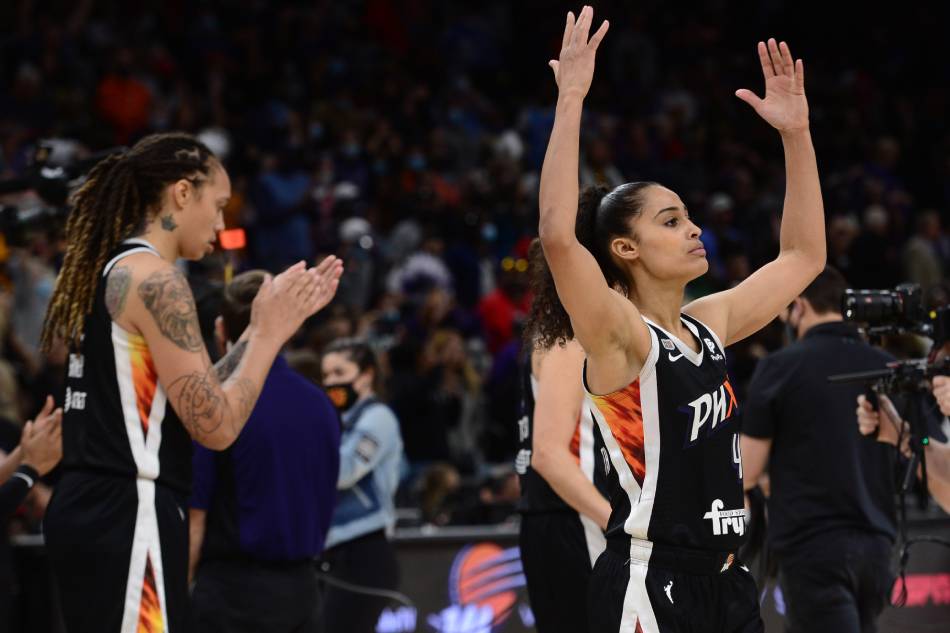 Phoenix Mercury center Brittney Griner (42) and guard Skylar Diggins-Smith (4) celebrate after defeating the Chicago Sky in game two of the 2021 WNBA Finals at Footprint Center. Joe Camporeale, USA TODAY Sports/Reuters.