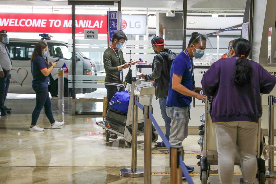 Some OFWs arrive at the lobby of the Ninoy Aquino International Airport Terminal 1 in Parañaque City on July 1, 2021. Jonathan Cellona, ABS-CBN News/File