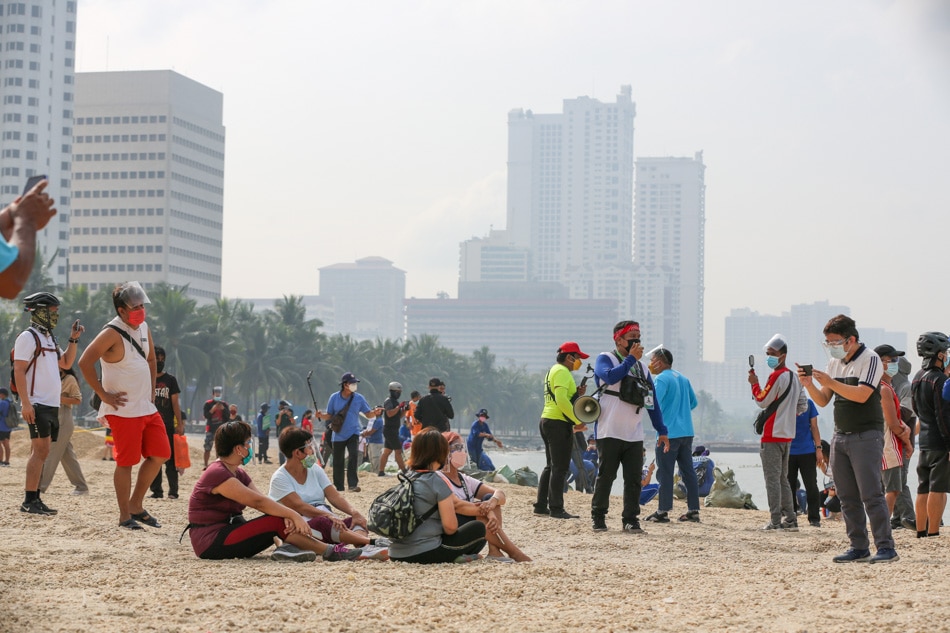  People flock to the spot on Roxas Boulevard covered with artificial sand at the reopening of the Manila Bay Dolomite Beach on Saturday, just as Metro Manila shifted to quarantine Alert Level 3 last year. Jonathan Cellona, ABS-CBN News/File