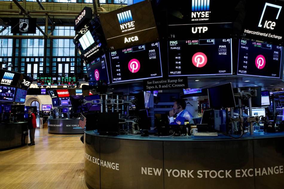 The Pinterest logo is displayed on screens above the trading on the floor of the New York Stock Exchange (NYSE) in New York City, US, October 20, 2021. Brendan McDermid, Reuters