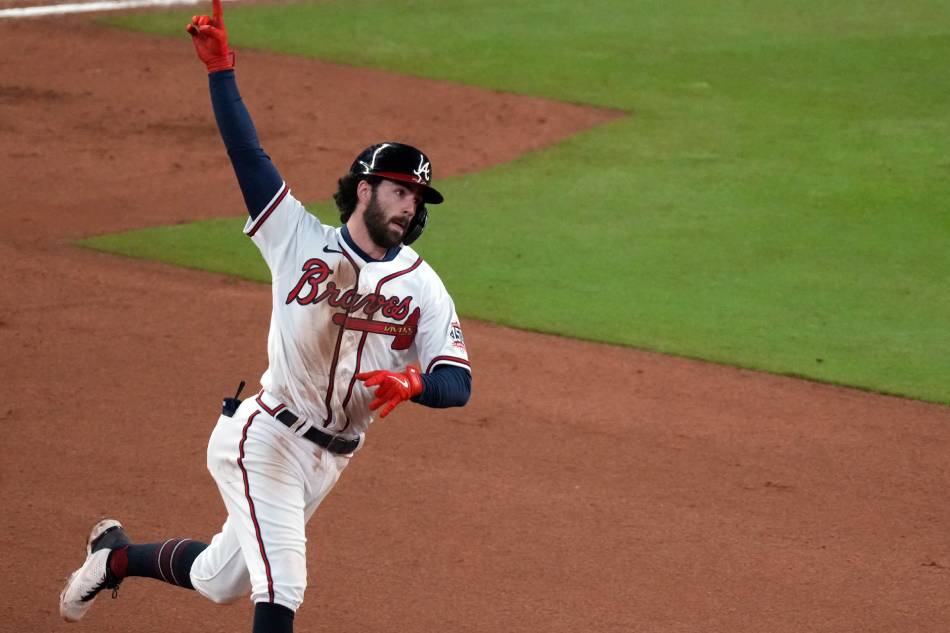 Atlanta Braves shortstop Dansby Swanson (7) rounds the bases after hitting a home run against the Houston Astros during the seventh inning of game four of the 2021 World Series at Truist Park. John David Mercer, USA TODAY Sports/Reuters.