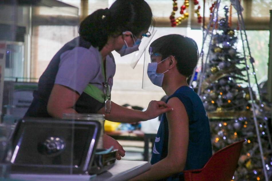 Young people, aged 12-17, receive their Pfizer COVID-19 (Pfizer) vaccine at the Navotas City Hospital on November 02, 2021. Jonathan Cellona, ABS-CBN News/File