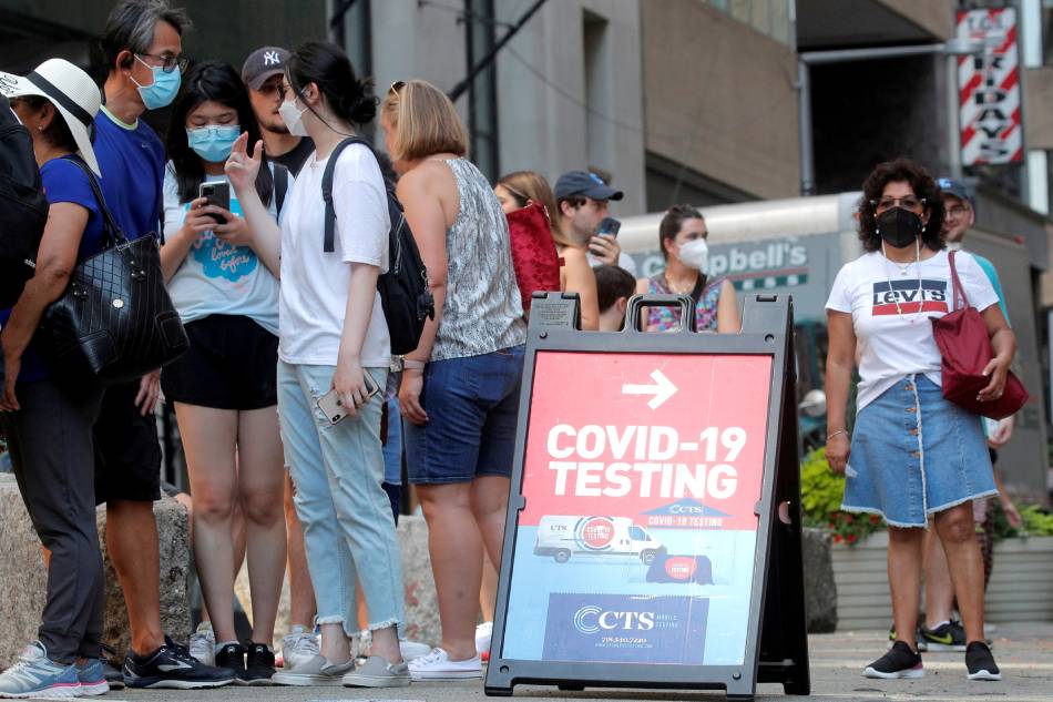 People line up at a COVID-19 testing at a mobile testing van in New York City, US, Aug. 27, 2021. Brendan McDermid, Reuters/File