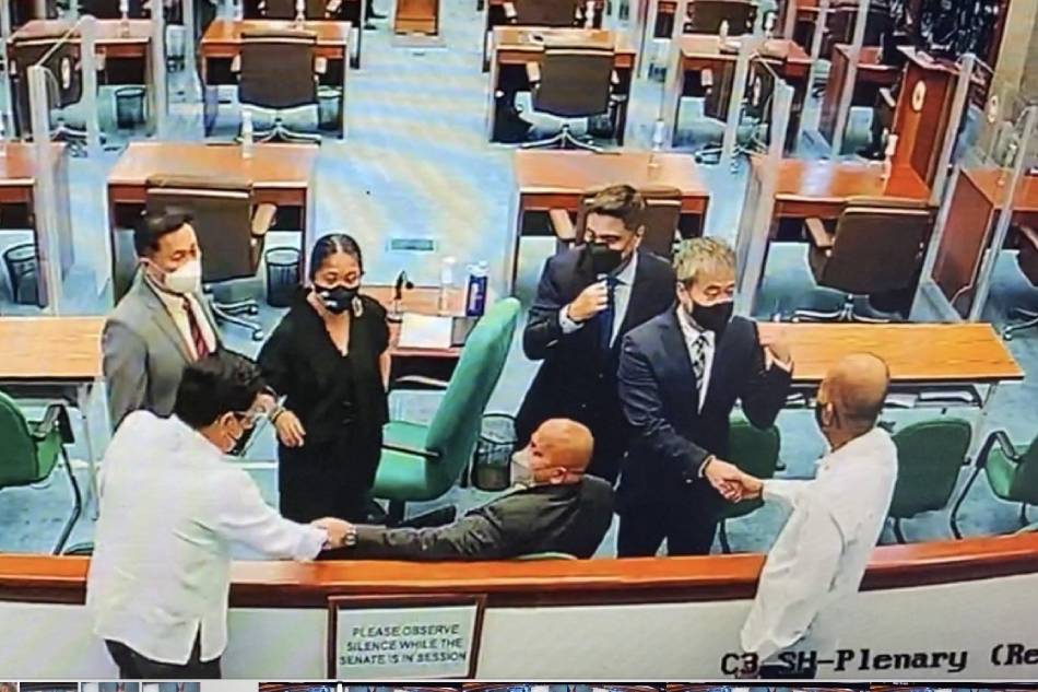 Defense Secretary Delfin Lorenzana (rightmost) is seen shaking hands with the Senator Joel Villanueva in this photo provided by the lawmaker. Senators Juan Miguel Zubiri, Nancy Binay, Ronald 
