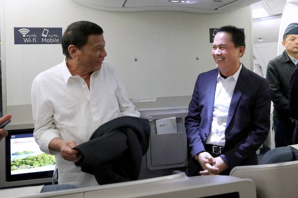 President Rodrigo Duterte shares a light moment with the Kingdom of Jesus Christ, The Name Above Every Name Founder and Executive Pastor Apollo Quiboloy while on board a plane bound for Davao City on Oct. 5, 2019. King Rodriguez, Presidential Photo/File