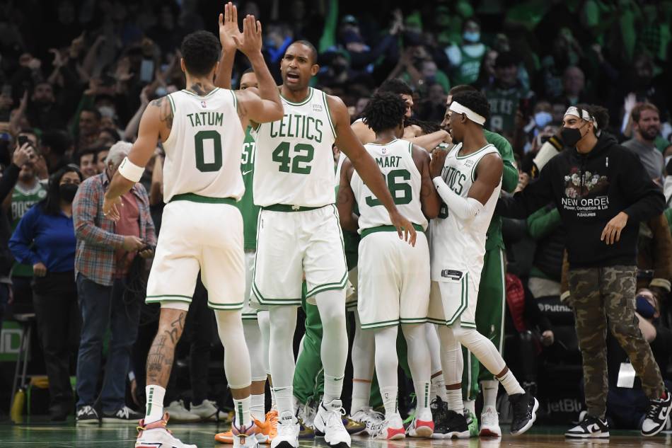 Boston Celtics forward Jayson Tatum (0) high fives center Al Horford (42) after defeating the Philadelphia 76ers at TD Garden. Bob DeChiara, USA TODAY Sports/Reuters.