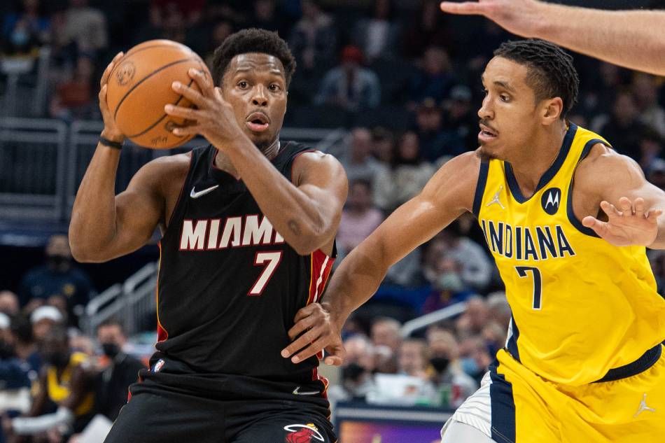 Miami Heat guard Kyle Lowry (7) passes the ball while Indiana Pacers guard Malcolm Brogdon (7) defends in the first half at Gainbridge Fieldhouse. Trevor Ruszkowski, USA TODAY Sports via Reuters