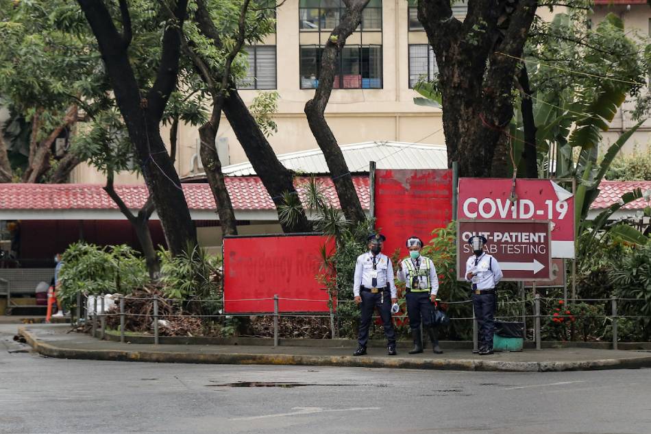 Security guards man the driveway of the Philippine General Hospital in Manila on August 24, 2021. George Calvelo, ABS-CBN News/File