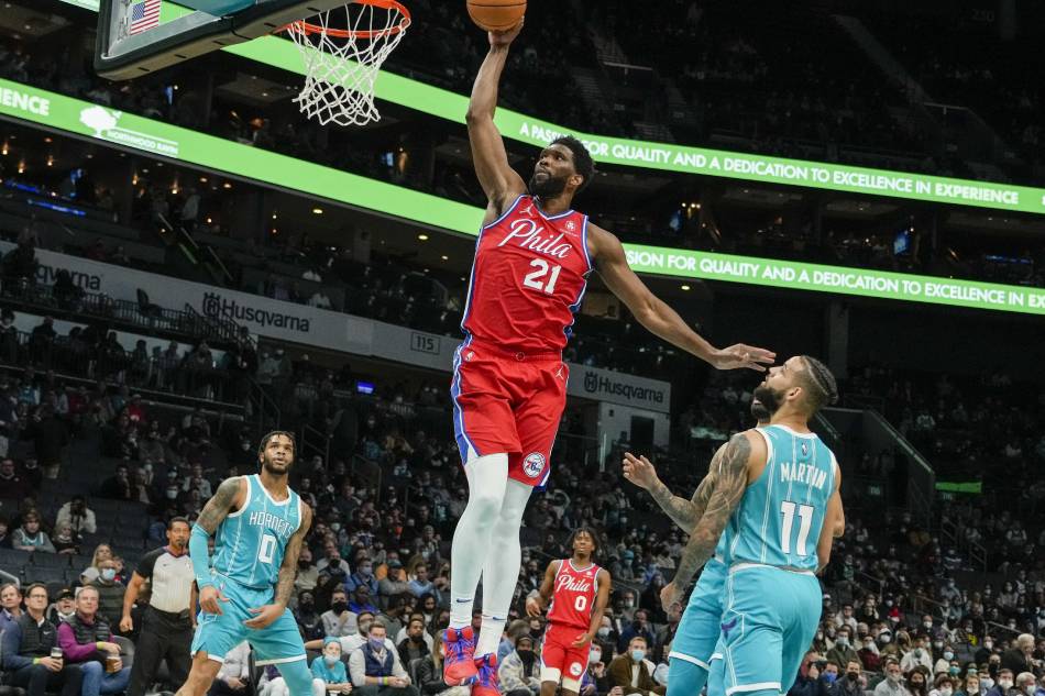 Philadelphia 76ers center Joel Embiid (21) gets a dunk on Charlotte Hornets forward Cody Martin (11) during the first quarter at the Spectrum Center. Jim Dedmon, USA TODAY Sports/Reuters.