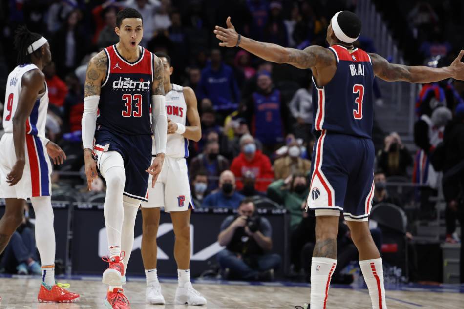 Washington Wizards forward Kyle Kuzma (33) celebrates his three point basket in overtime with guard Bradley Beal (3) in overtime at Little Caesars Arena. Rick Osentoski, USA TODAY Sports/Reuters.