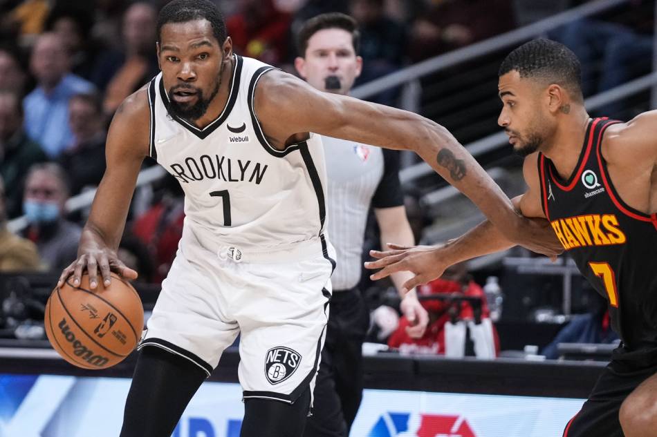 Brooklyn Nets forward Kevin Durant (7) dribbles against Atlanta Hawks guard Timothe Luwawu-Cabarrot (7) during the first half at State Farm Arena. Dale Zanine, USA TODAY Sports via Reuters