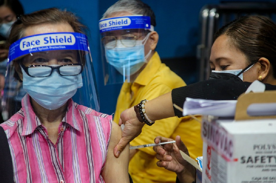 Senior citizens receive their COVID-19 vaccine booster shots at the Filoil San Juan Arena in San Juan City on December 03, 2021. Jonathan Cellona, ABS-CBN News/File