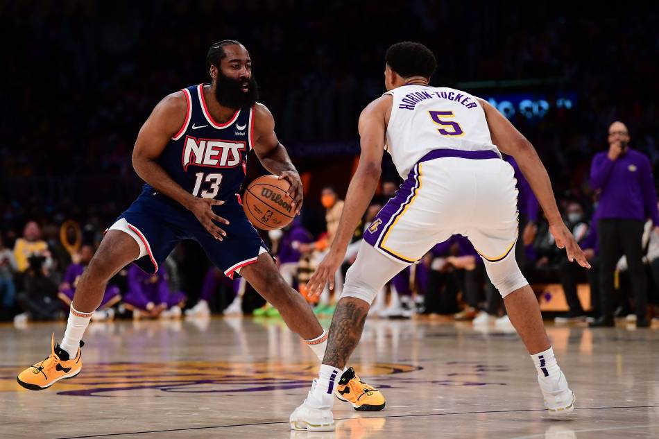 Brooklyn Nets guard James Harden (13) controls the ball against Los Angeles Lakers guard Talen Horton-Tucker (5) during the first half at Crypto.com Arena. Gary A. Vasquez, USA TODAY Sports/Reuters.