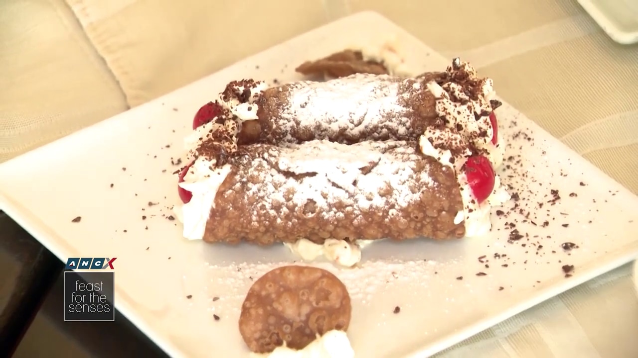 Rossini's Cannoli is a crispy rolled shell filled with ricotta and cherries and a little bit of cacao. Photo Source: ANCX Feast for the Senses