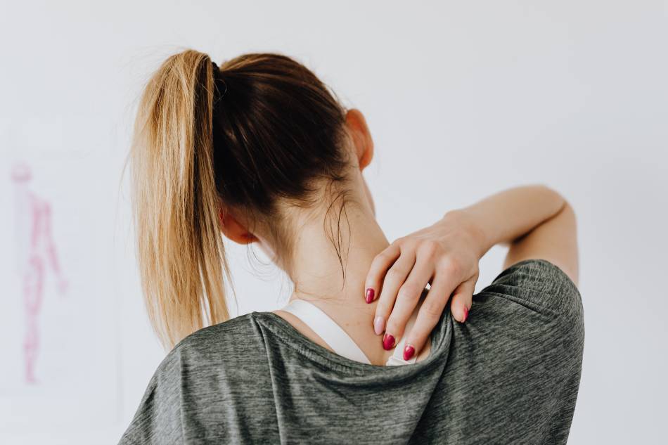 Photo source: Pexels [LINK OUT 'Pexels': https://www.pexels.com/photo/woman-touching-her-back-4506105
