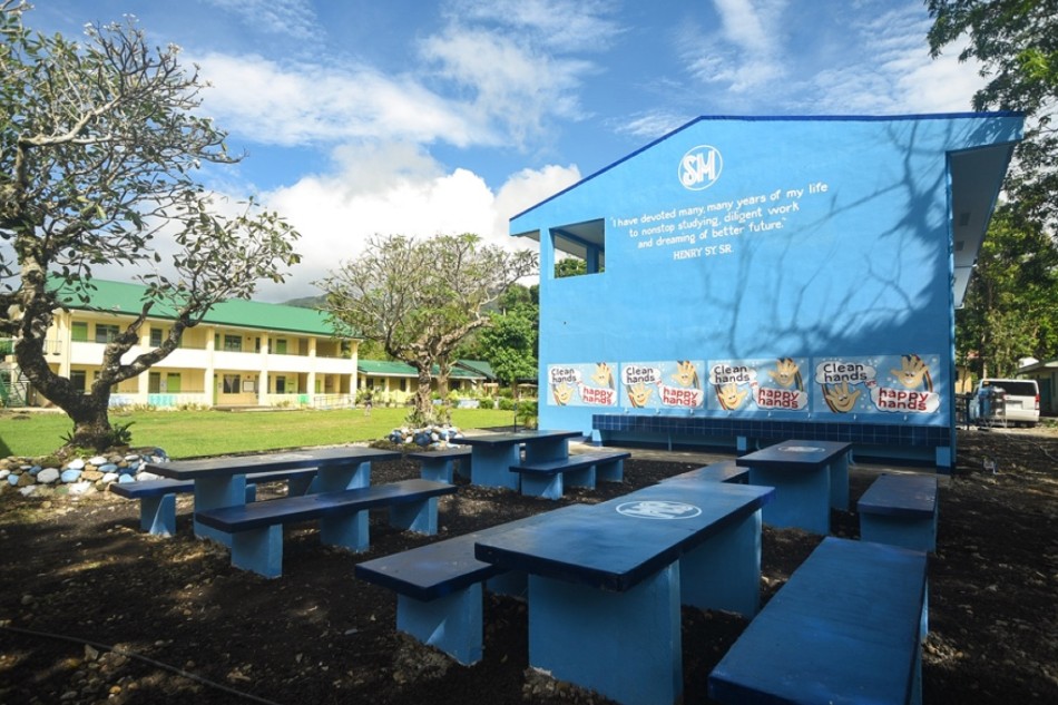One of the school buildings constructed under the Adopt-A-School Program, with green space which promotes environmental consciousness. Photo source: SMFI