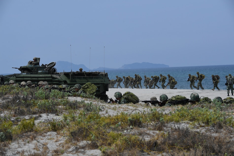 Philippine and US marines simulate an amphibious landing as part of the annual joint military exercise in San Antonio, Zambales on May 9, 2018. The US and Philippine militaries launched major exercises on May 7 aimed at fighting global terrorism, while staying mostly quiet on Beijing's reported installation of missiles in the disputed South China Sea. Ted Aljibe, AFP