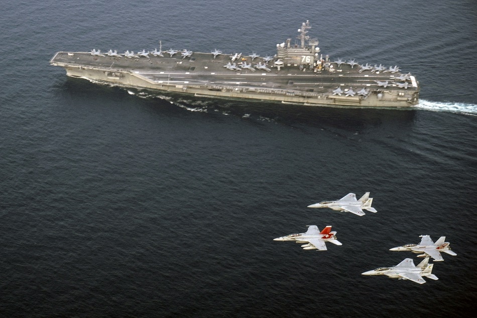 This US Navy photo obtained June 2, 2017 shows US Navy and Japan Air Self-Defense Force aircraft as they fly in formation over the Nimitz-class aircraft carrier USS Ronald Reagan (CVN 76)on June 1, 2017 in the Sea of Japan. The US Navy and Japan Air Self-Defense Force routinely fly together to continue efforts of supporting security and stability in the Indo-Asia-Pacific region. Artur Sedrakyar, US Navy/AFP/file
