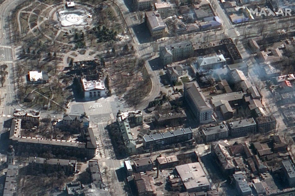 This handout picture taken and released on March 19, 2022 by Maxar satellite image shows the aftermath of the airstrike on the Mariupol Drama Theater, in Mariupol southern Ukraine. Rescuers in Ukraine searched that day for hundreds of civilians feared trapped under the wreckage of the bombed theater, as local forces battle against Russian troops across the country. AFP/Satellite image ©2022 Maxar Technologies