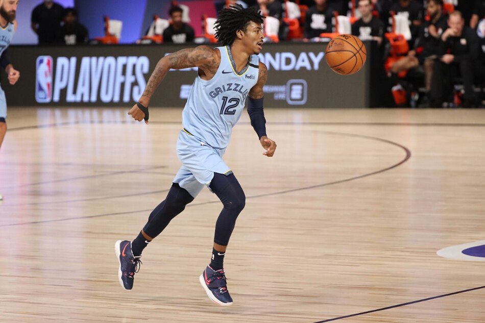 Ja Morant #12 of the Memphis Grizzlies handles the ball during the game against the Portland Trail Blazers during the Western Conference Play in Game on August 15, 2020 at The Field House at ESPN Wide World Of Sports Complex in Orlando, Florida. File photo. Joe Murphy, NBAE via Getty Images/AFP.