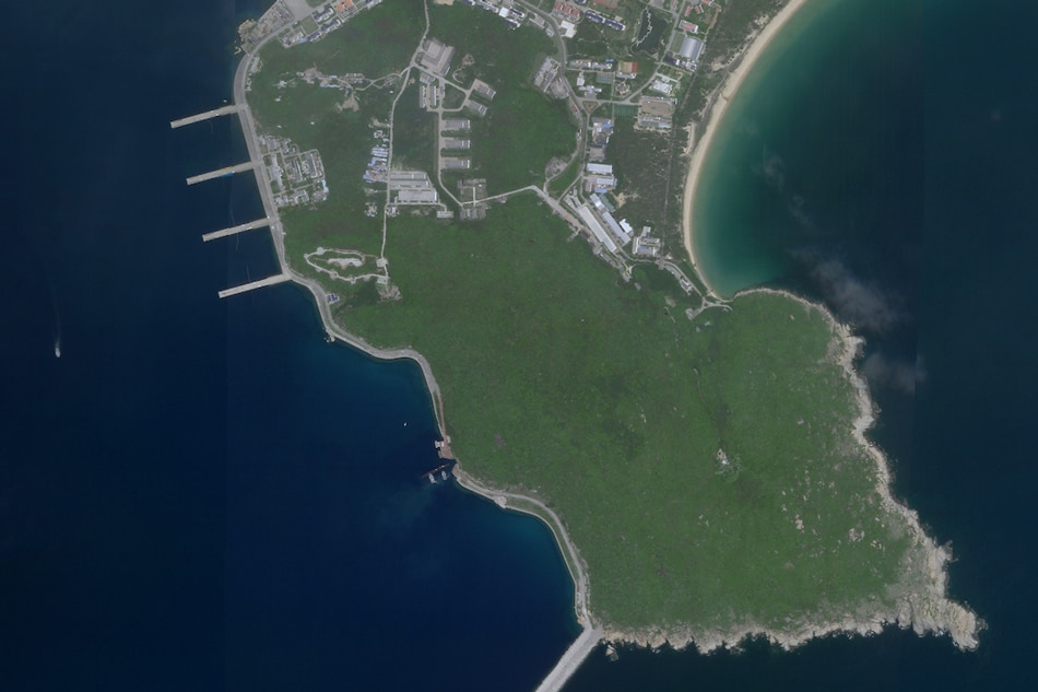  This Aug. 18, 2020, image courtesy of Planet Labs, Inc., reportedly show a Chinese submarine (C, bottom) entering an underground base on Hainan Island on the South China Sea. The satellite image appears to show a Type 093 nuclear-powered attack submarine entering a tunnel on Yulin Naval Base. Planet Labs, Inc. via AFP
