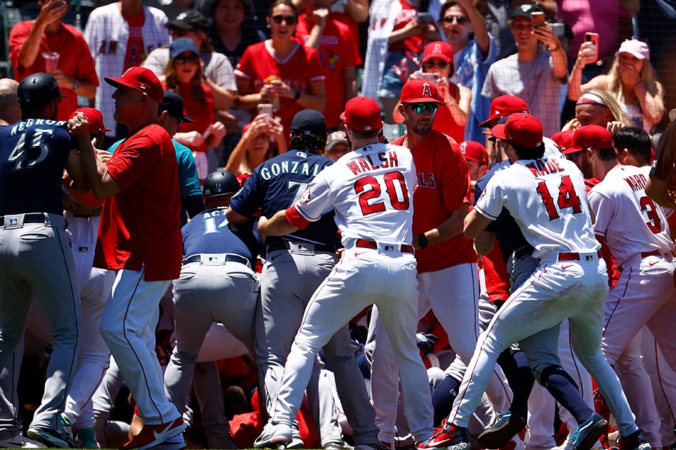 The Seattle Mariners and the Los Angeles Angels clear the benches after Jesse Winker #27 of the Seattle Mariners charged the Angels dugout after being hit by a pitch in the second inning at Angel Stadium of Anaheim on June 26, 2022 in Anaheim, California. Ronald Martinez, Getty Images/AFP.