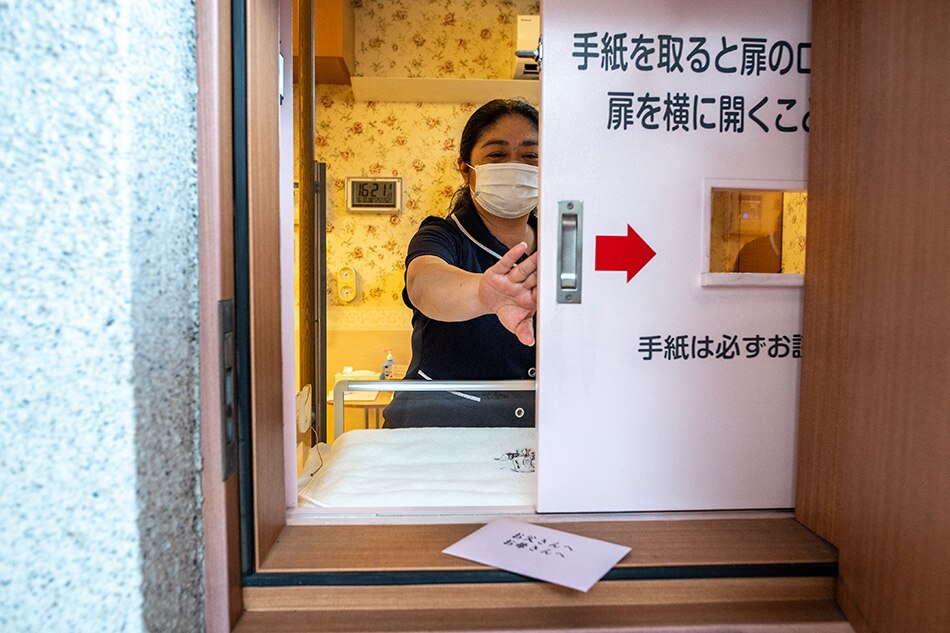 In this picture taken on June 10, 2022, a staff member demonstrates the baby hatch room at Jikei hospital in Kumamoto. When the alarm sounds at Jikei hospital in southern Japan, nurses race down a spiral staircase. Their mission: to rescue an infant left in the country's only baby hatch. Philip Fong, AFP